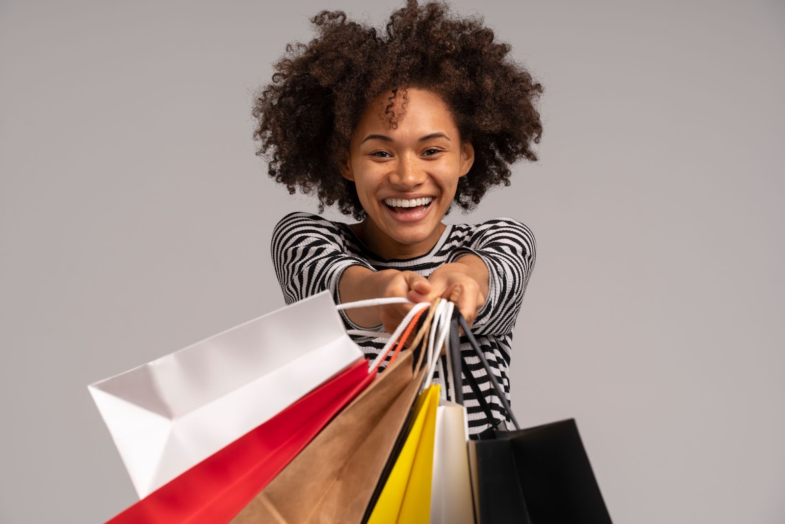 Woman holding holiday sales bags